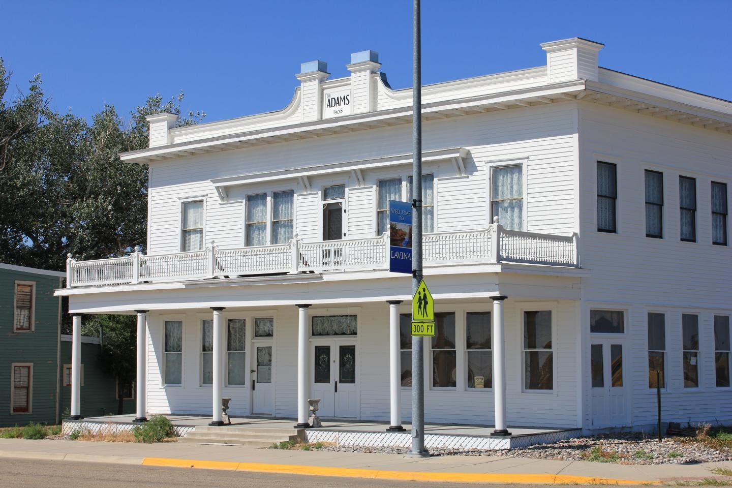 The Adams Hotel entrance with flowers and columns