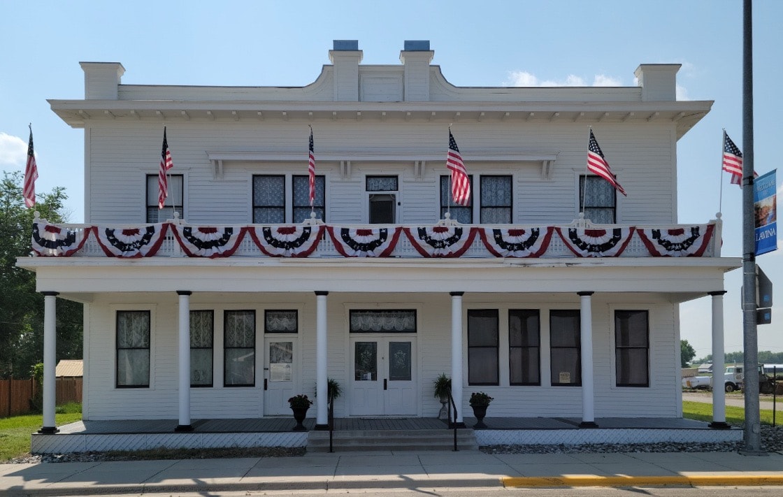 Adams Hotel front facade decorated with patriotic bunting after restoration
